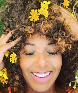 Woman with yellow flowers in her hair