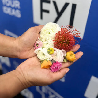 Hand holding flowers